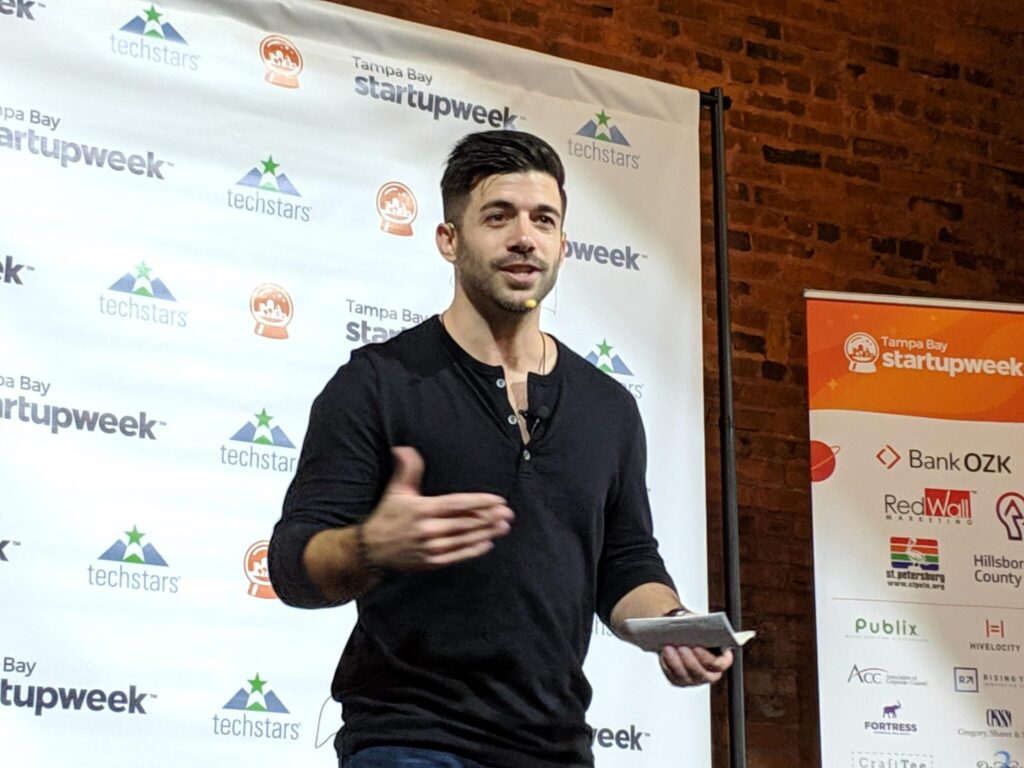 Steven Fage on stage at Startup Week in Tampa Bay